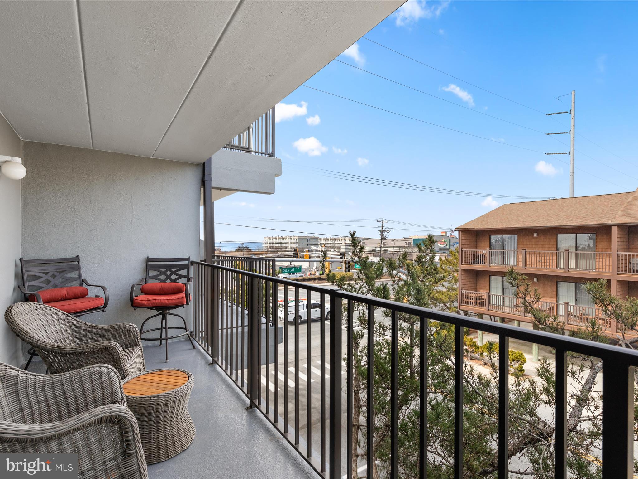 17 70th Street, Unit 25 Ocean City, MD 21842 - Photo 30 of 37 a balcony with lots of chairs and a table