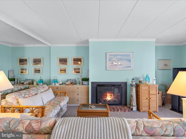 a living room with furniture large window and a flat screen tv