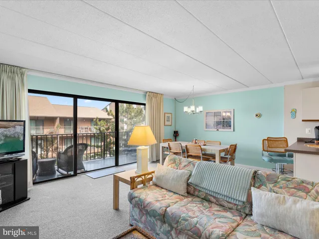 a dining room with a table and chairs