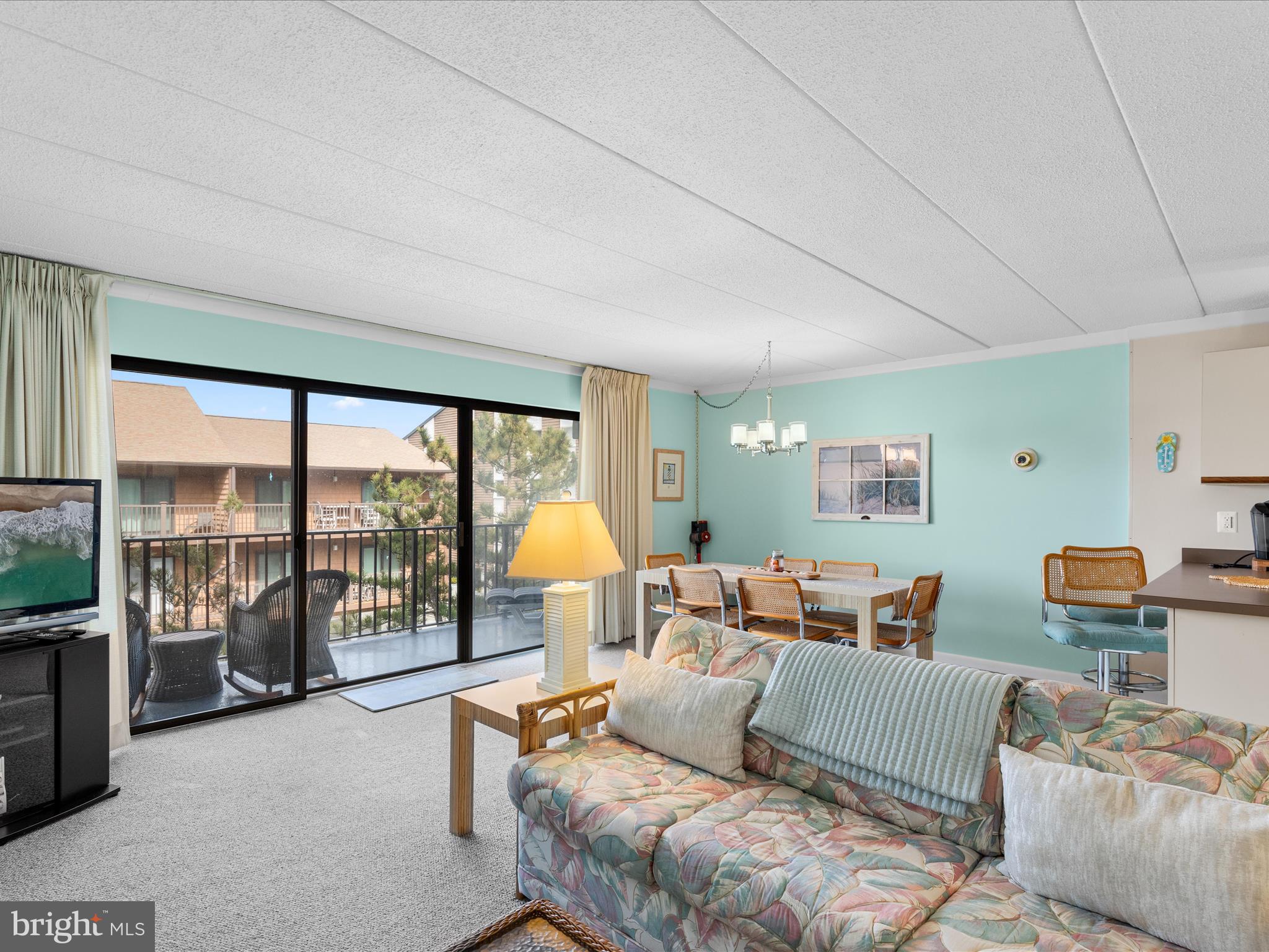 17 70th Street, Unit 25 Ocean City, MD 21842 - Photo 10 of 37 a living room with furniture and a large window