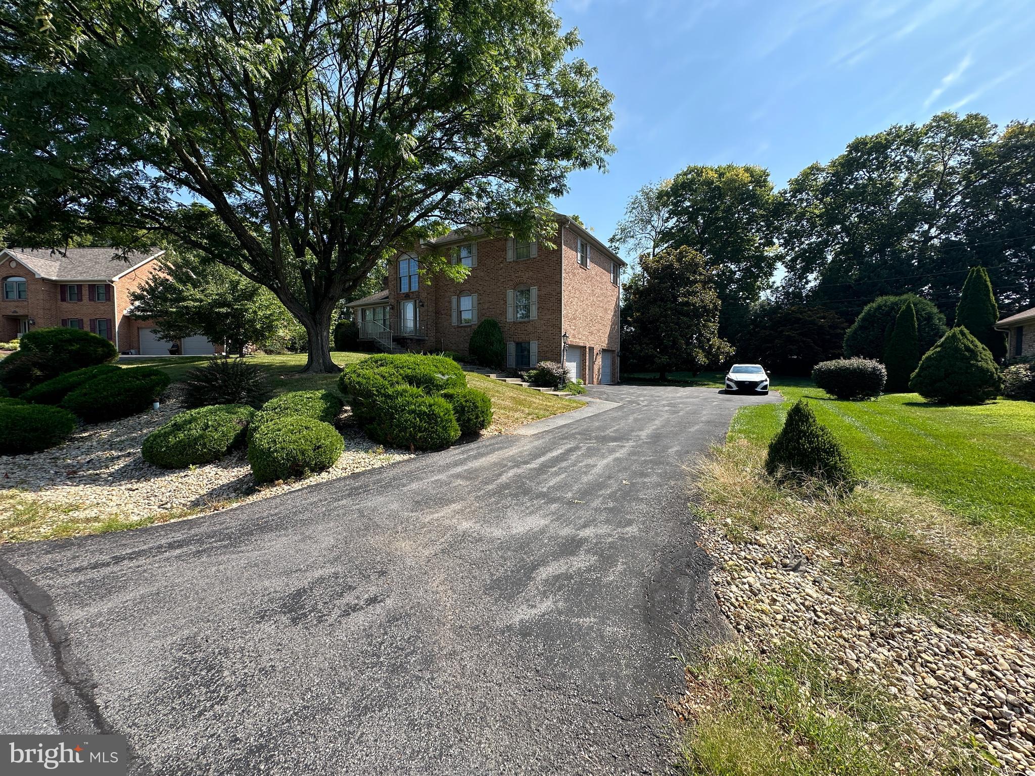 10744 Apple Tree Lane Williamsport, MD 21795 - Photo 3 of 118 a front view of a house with a yard and garage