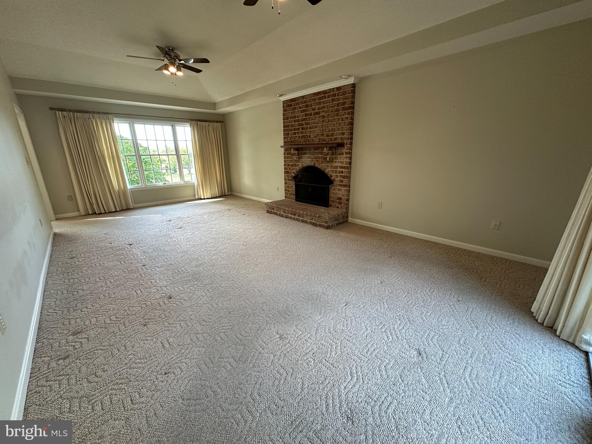 10744 Apple Tree Lane Williamsport, MD 21795 - Photo 36 of 118 a view of empty room with fireplace and fan