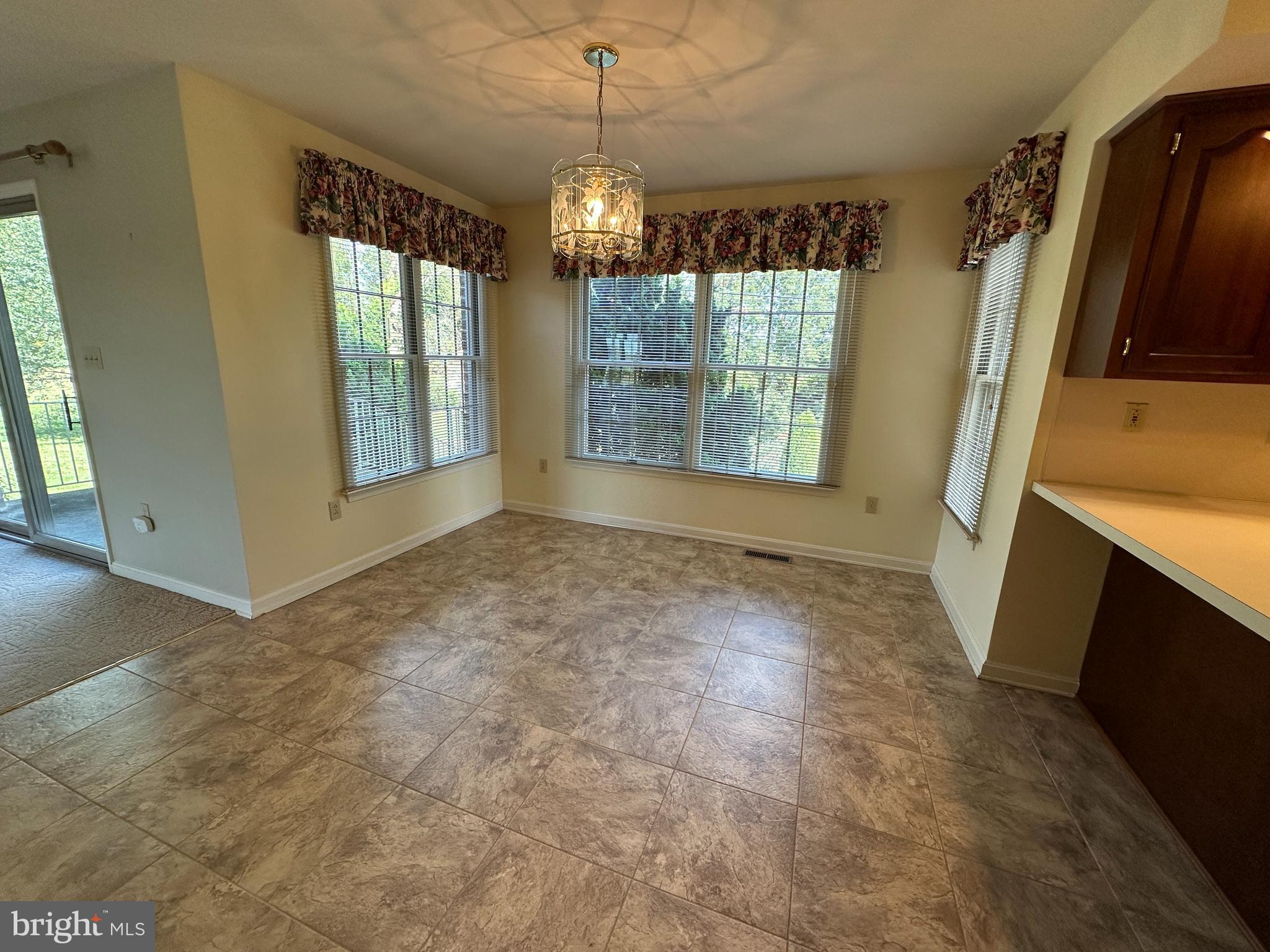 10744 Apple Tree Lane Williamsport, MD 21795 - Photo 40 of 118 a view of an empty room with a fireplace and a window