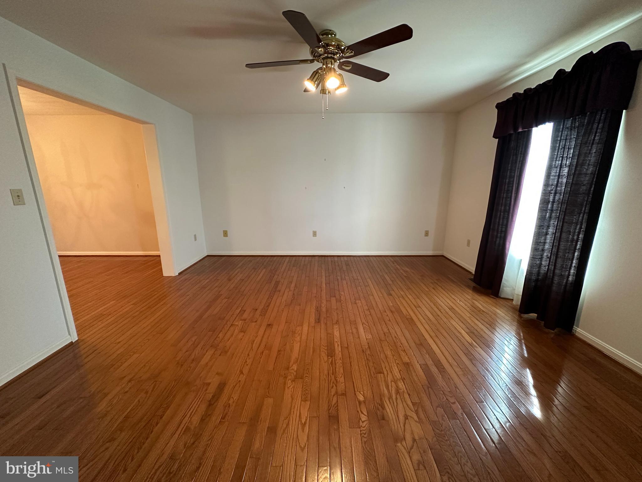 10744 Apple Tree Lane Williamsport, MD 21795 - Photo 55 of 118 wooden floor in an empty room with a window