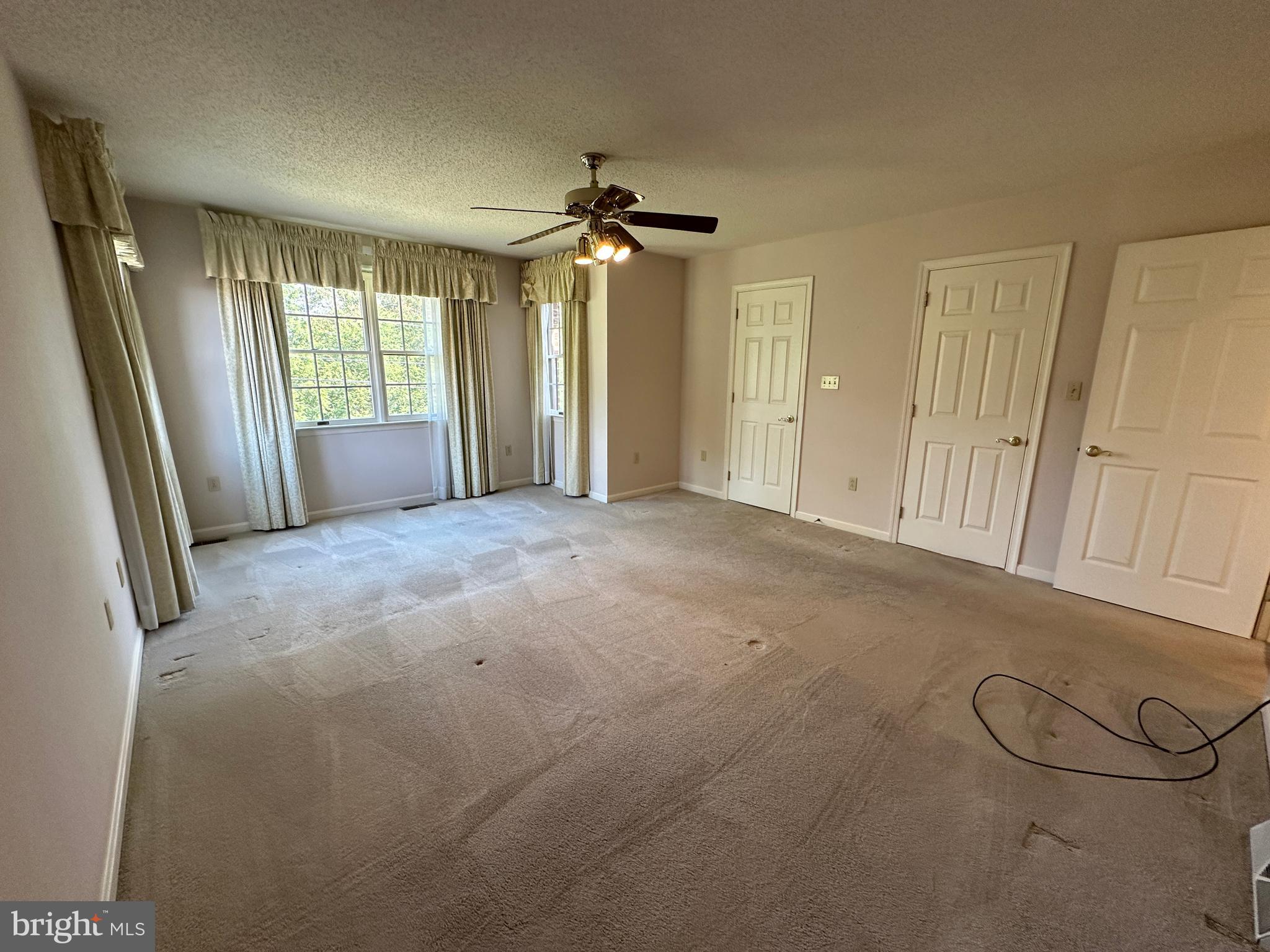10744 Apple Tree Lane Williamsport, MD 21795 - Photo 70 of 118 a view of a livingroom with a chandelier fan and windows