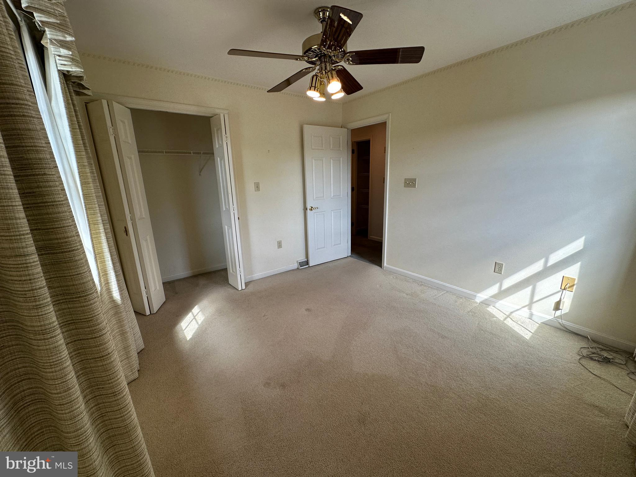 10744 Apple Tree Lane Williamsport, MD 21795 - Photo 84 of 118 a view of a livingroom with a ceiling fan and window