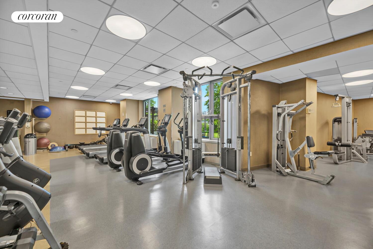 455 Main Street, Unit 16A Manhattan, NY 10044 - Photo 16 of 18 a view of a room with gym equipment