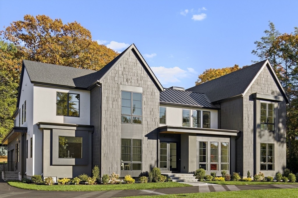 56 Bigelow Road Newton, MA 02465 - Photo 2 of 32 a front view of a house with a garden