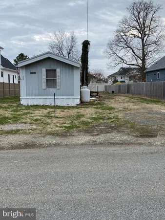 a fire hydrant in the middle of a yard
