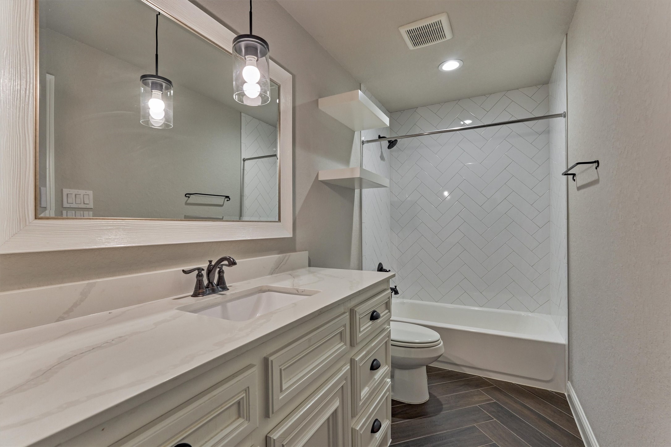 11618 Renaissance Drive Montgomery, TX 77356 - Photo 34 of 49 The second-floor full bath features the same designer finishes and coordinating tile patterns found throughout the home, maintaining a cohesive and elevated look.