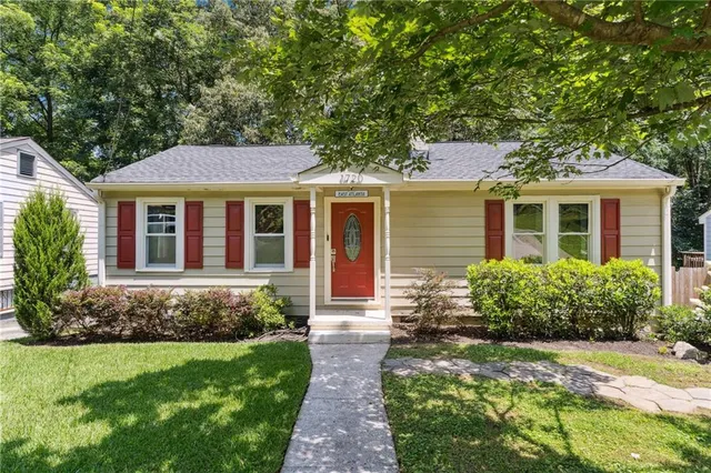 a front view of a house with garden