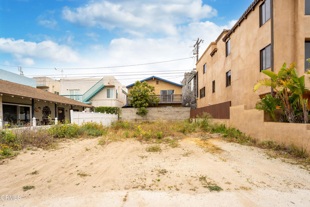 274 Sunset Drive Oxnard, CA 93035 - Photo 5 of 8 a view of a white house with a snow in the yard