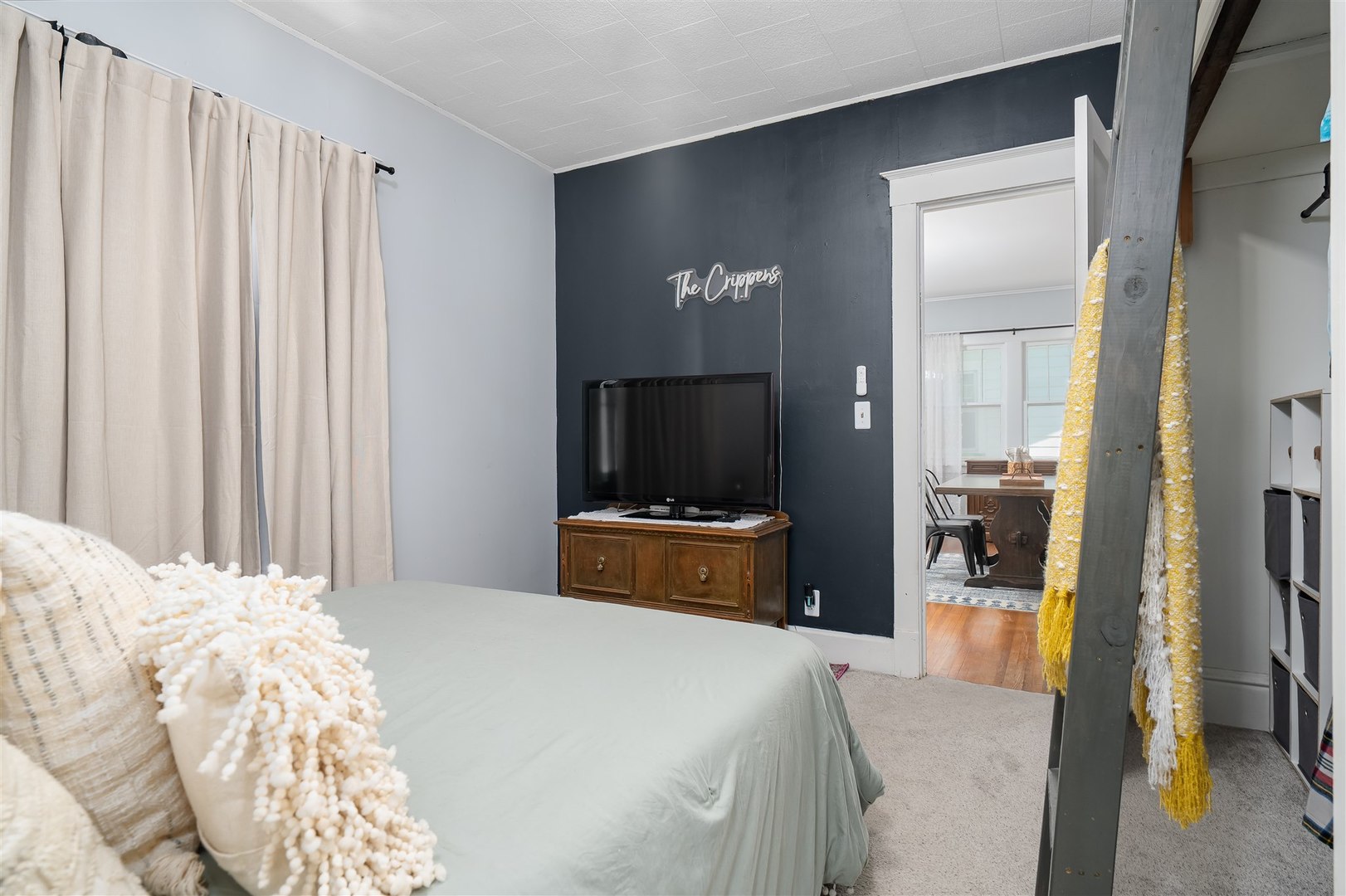 504 Normal Avenue Normal, IL 61761 - Photo 12 of 24 a bedroom with a bed and a television
