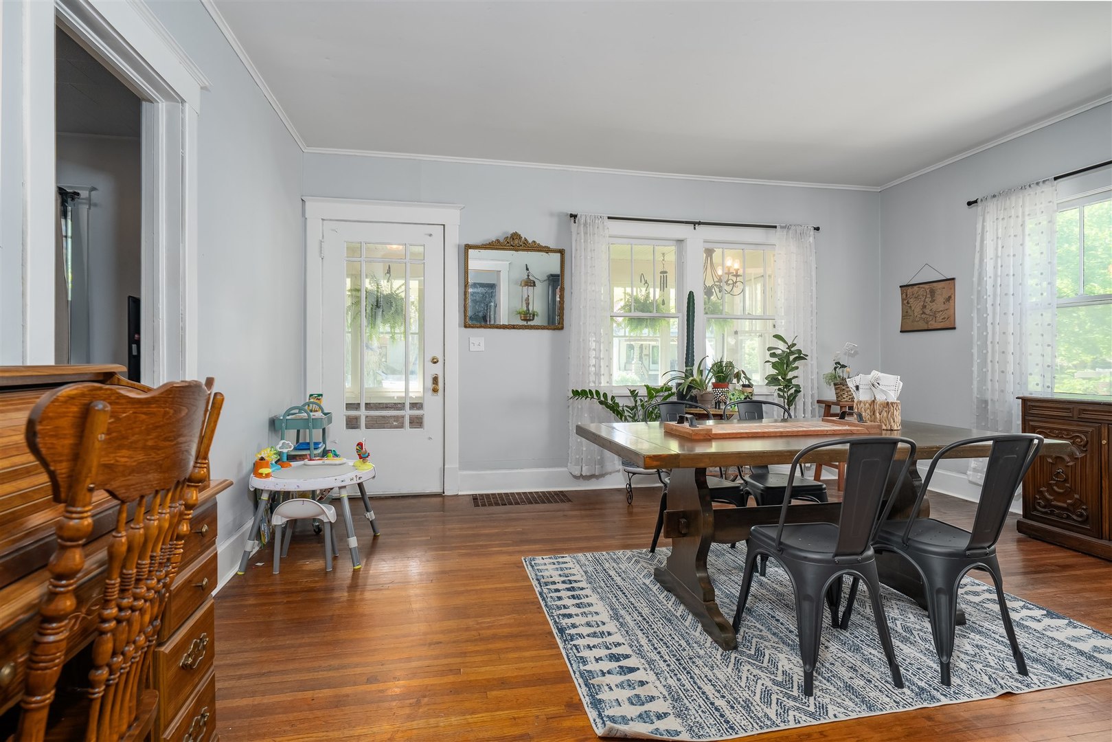 504 Normal Avenue Normal, IL 61761 - Photo 4 of 24 a view of a dining room with furniture window and wooden floor