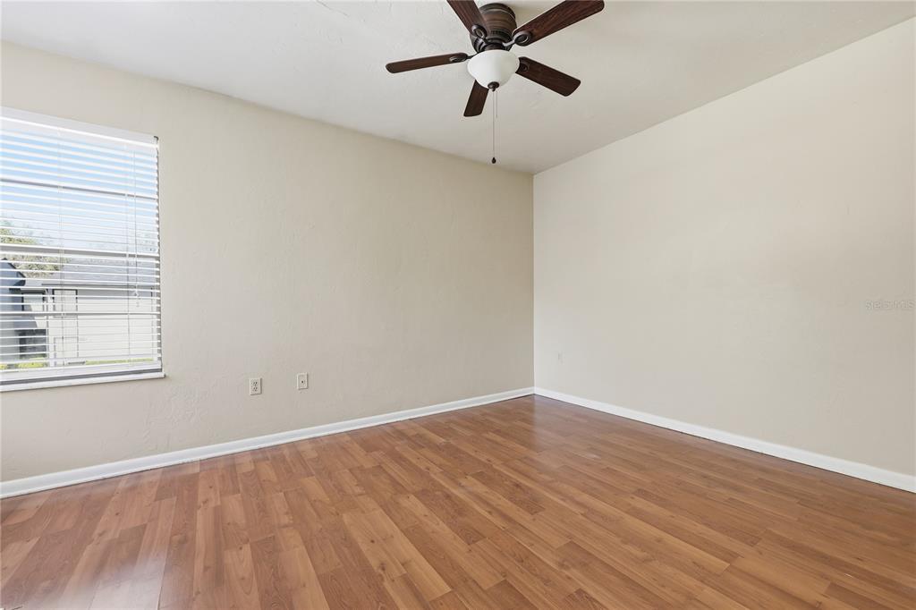 4427 Southwest 21st Lane Gainesville, FL 32607 - Photo 22 of 36 a view of a room with wooden floor and windows
