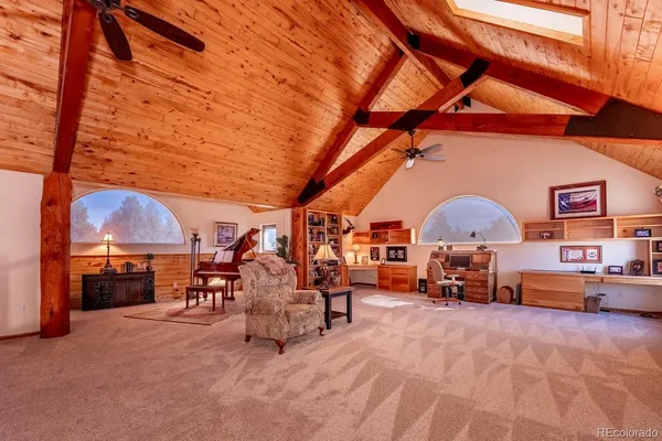 a living room with furniture rug and window