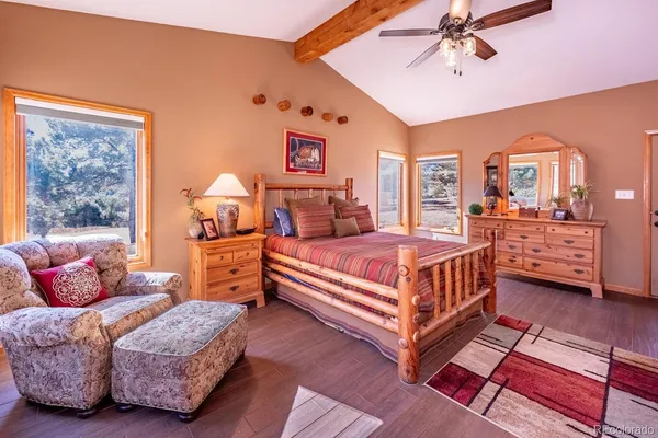 a spacious bathroom with a double vanity sink a two mirror a window and a shower