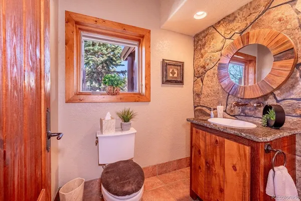 a bathroom with a sink double vanity and a mirror
