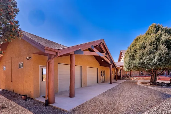 a aerial view of a house with table and chairs