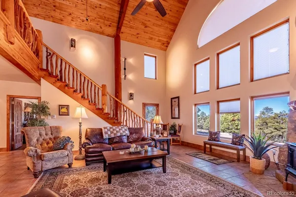 a kitchen with stainless steel appliances granite countertop a stove refrigerator and sink