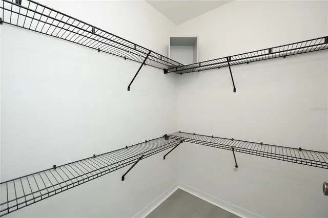 a view of a room with racks on the wall