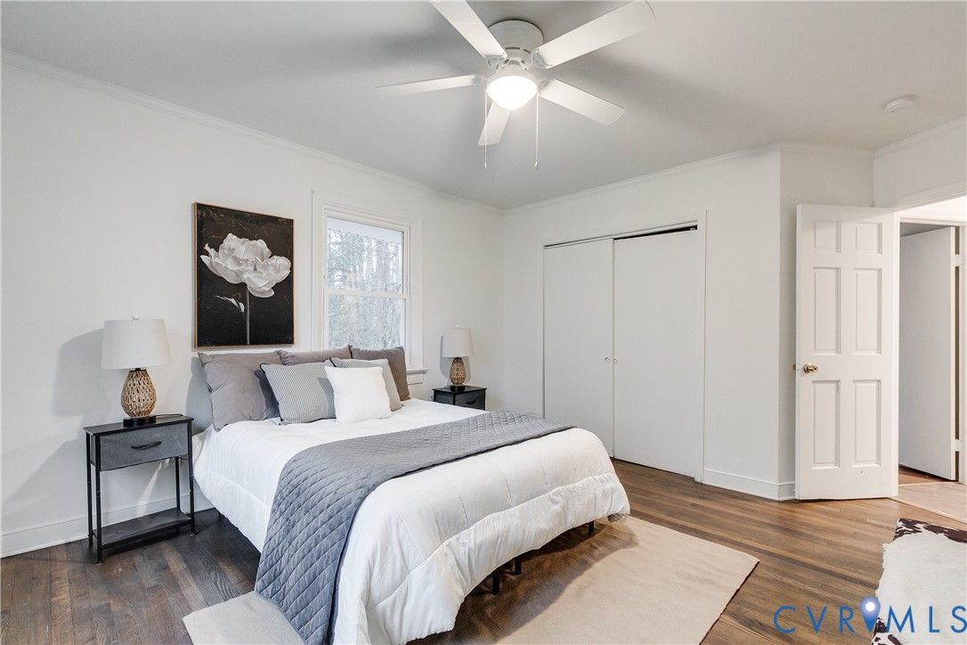 763 Oak Spring Lane Manakin-Sabot, VA 23103 - Photo 22 of 25 a bedroom with a large bed and a chandelier