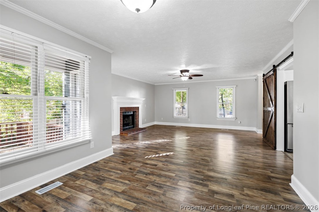 1205 Crossbend Court Fayetteville, NC 28314 - Photo 12 of 37 an empty room with wooden floor and windows