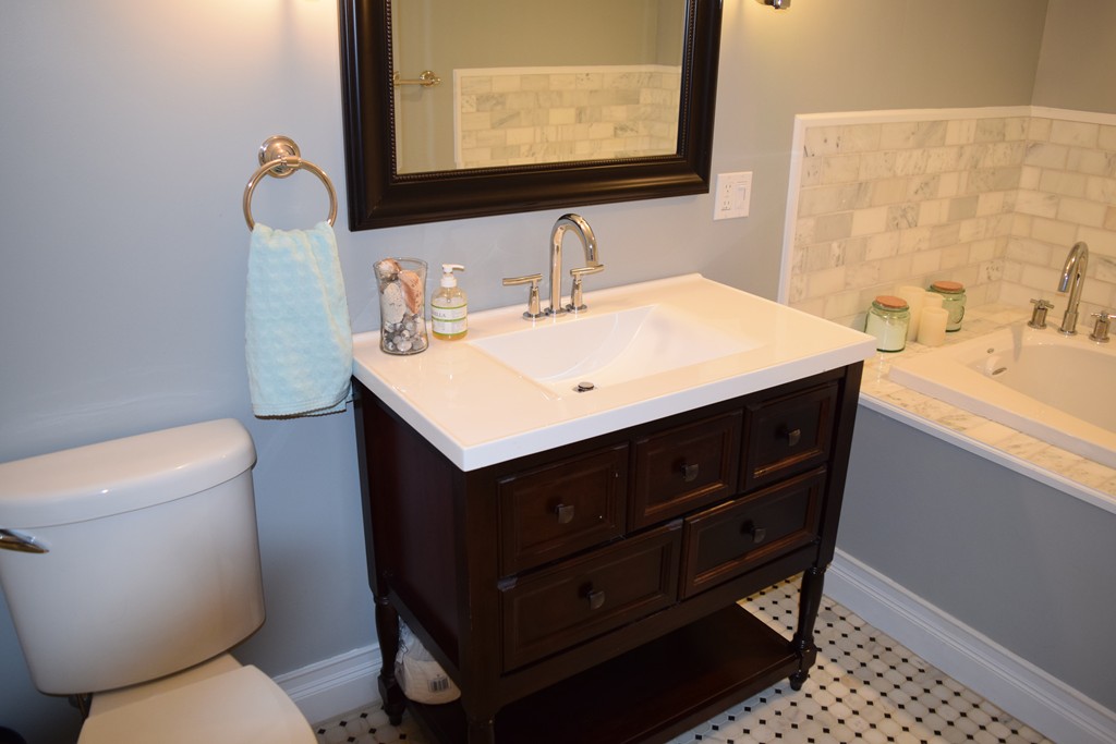 168 Boston Post Road Wayland, MA 01778 - Photo 12 of 22 a bathroom with a sink vanity mirror and toilet