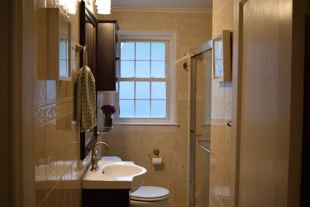 168 Boston Post Road Wayland, MA 01778 - Photo 7 of 22 a bathroom with a sink toilet and shower