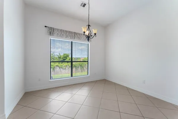 a large kitchen with a cabinets and stainless steel appliances