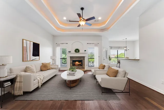 a living room with furniture and a fireplace