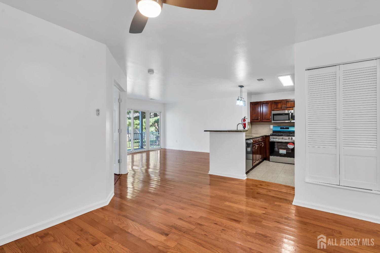 812 Edpas Road New Brunswick, NJ 08901 - Photo 1 of 31 a view of a kitchen with furniture and wooden floor