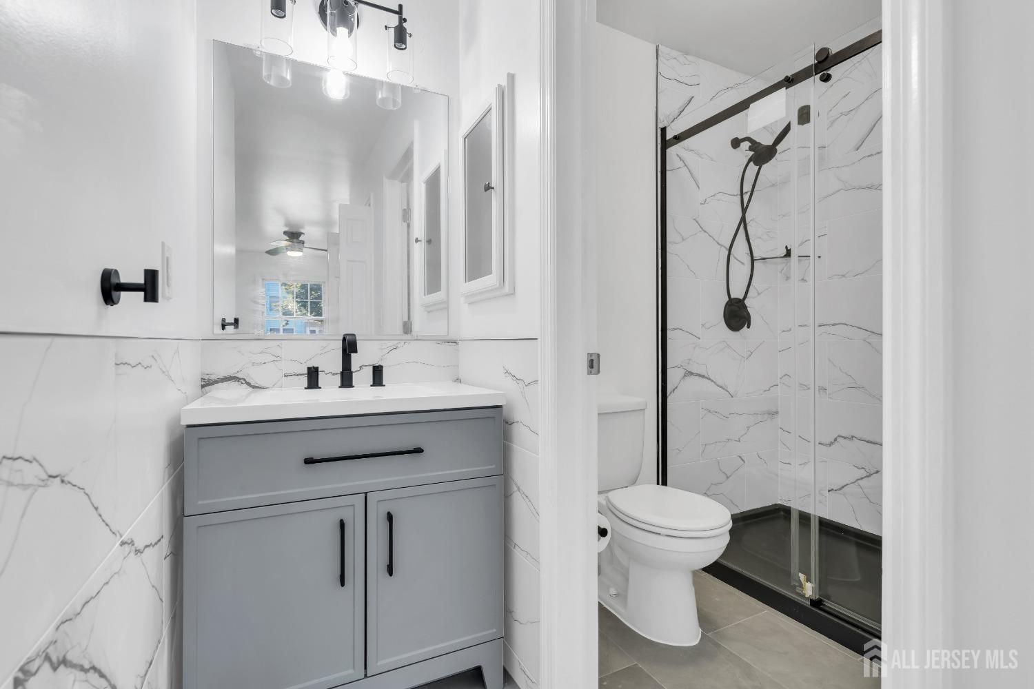 812 Edpas Road New Brunswick, NJ 08901 - Photo 12 of 31 a bathroom with a sink toilet and shower