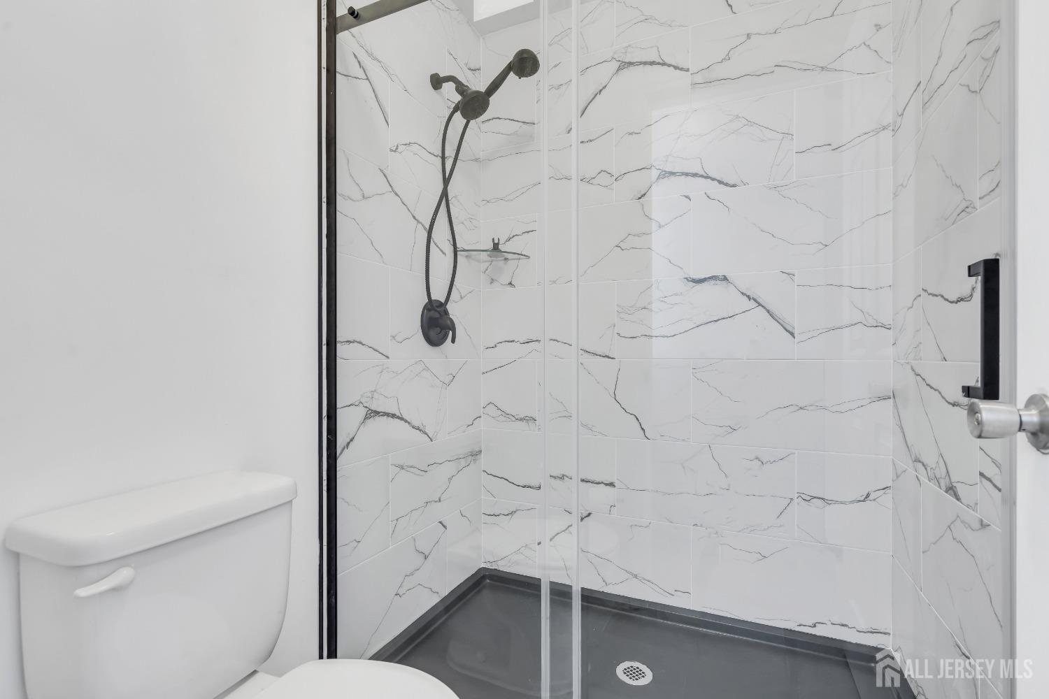 812 Edpas Road New Brunswick, NJ 08901 - Photo 13 of 31 a bathroom with a toilet and a shower