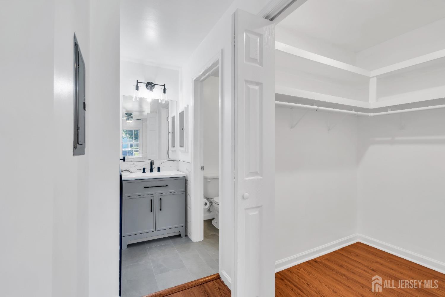 812 Edpas Road New Brunswick, NJ 08901 - Photo 14 of 31 a bathroom with a sink a mirror and a shower