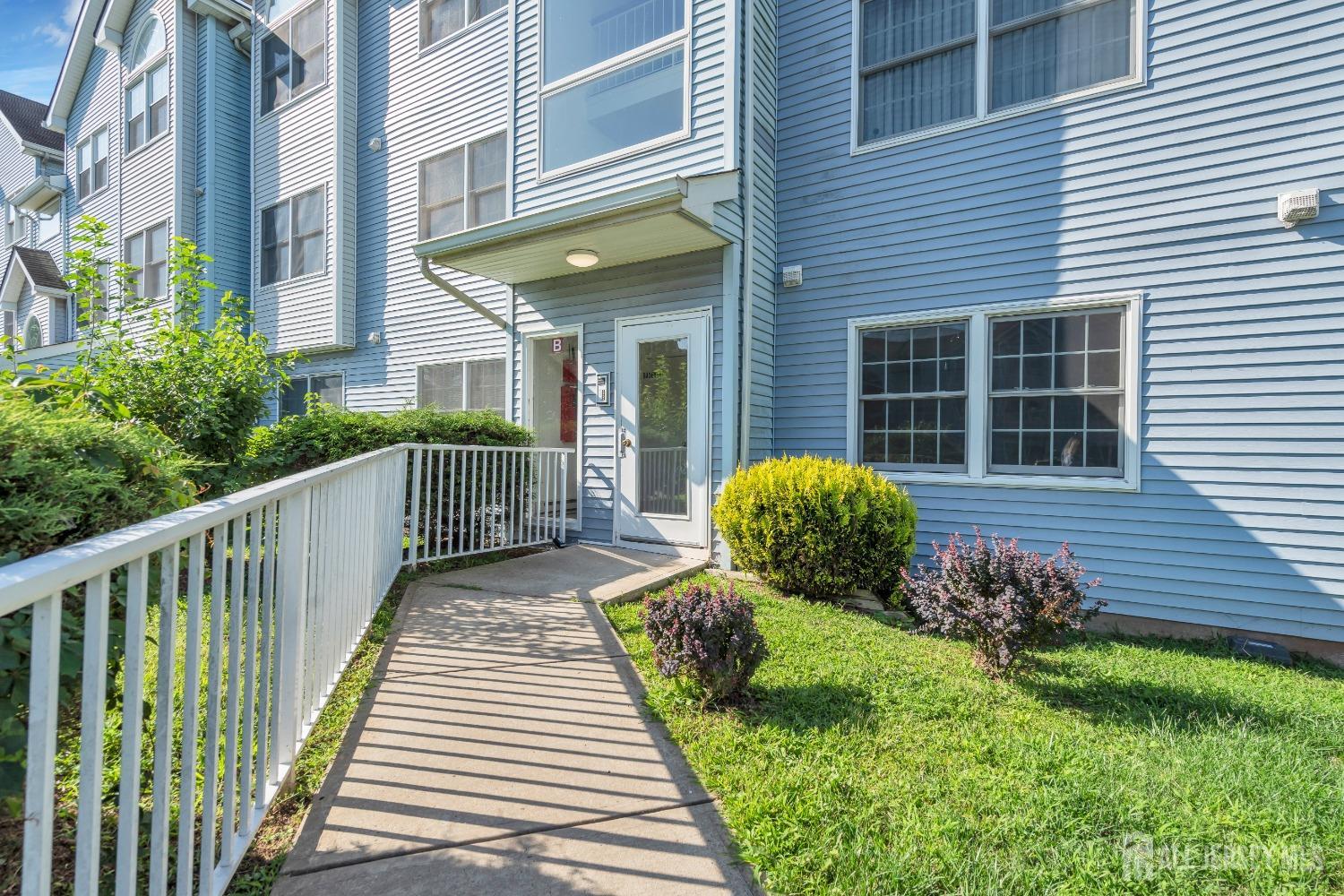812 Edpas Road New Brunswick, NJ 08901 - Photo 28 of 31 a view of a house with a small yard and wooden floor and a fence