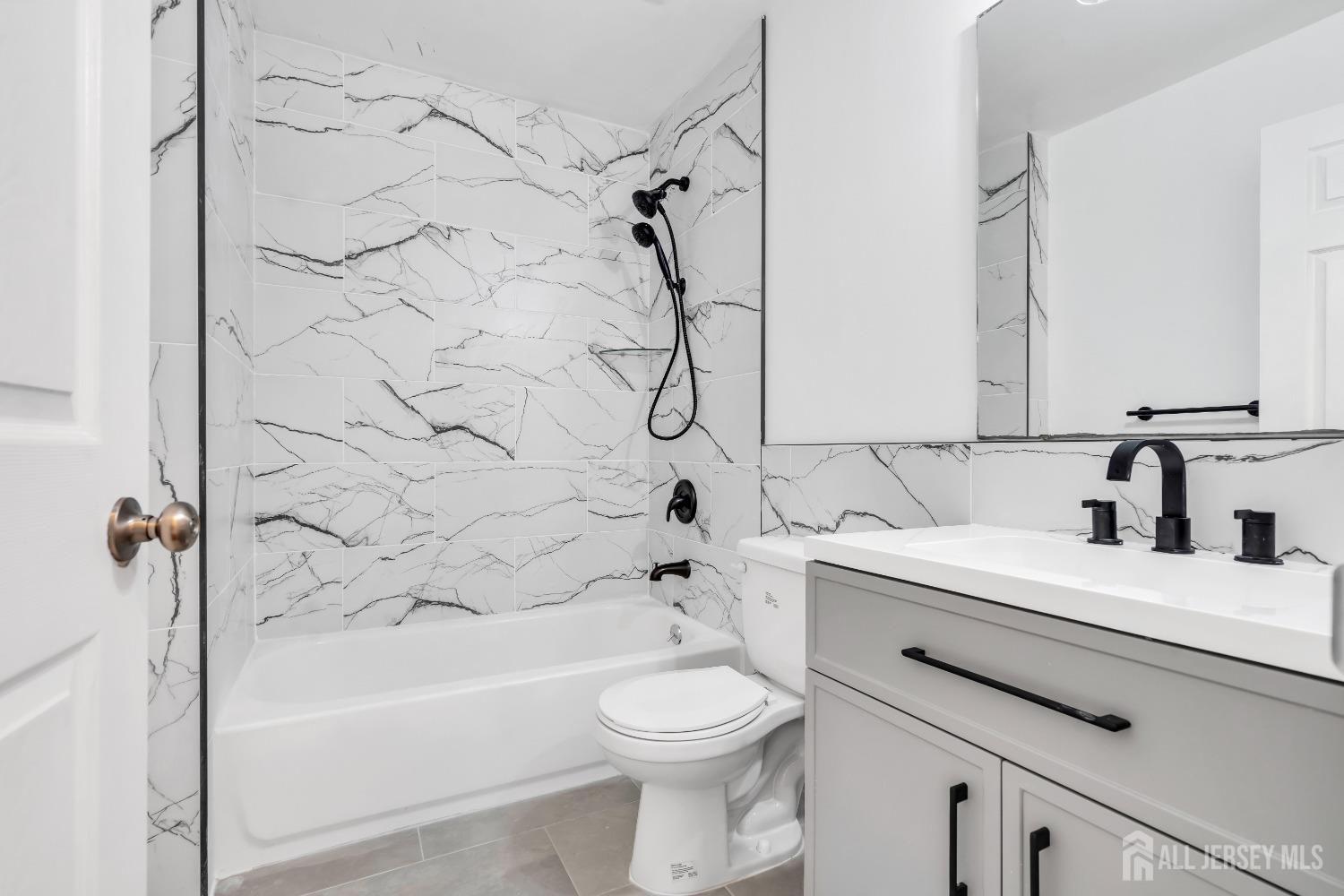 812 Edpas Road New Brunswick, NJ 08901 - Photo 5 of 31 a bathroom with a sink a toilet and a bathtub