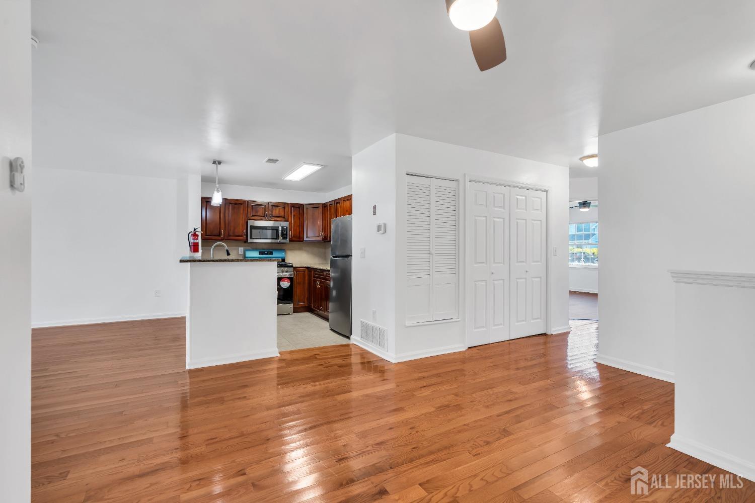 812 Edpas Road New Brunswick, NJ 08901 - Photo 6 of 31 a view of kitchen and hall with wooden floor