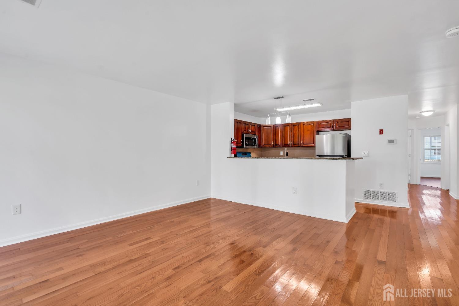 812 Edpas Road New Brunswick, NJ 08901 - Photo 7 of 31 a view of a kitchen with wooden floor