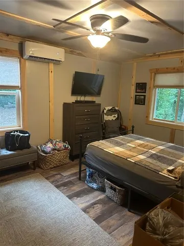 a bedroom with bed and a chandelier