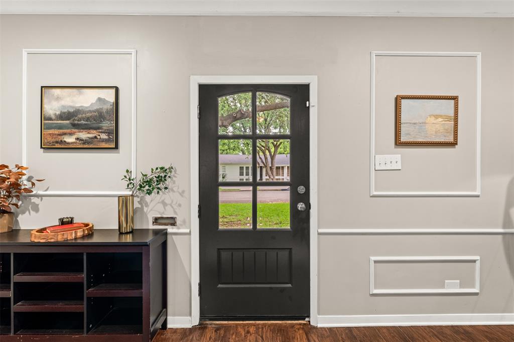 3116 Alexander Avenue Waco, TX 76708 - Photo 4 of 40 a view of a workspace room with wooden floor and cabinet