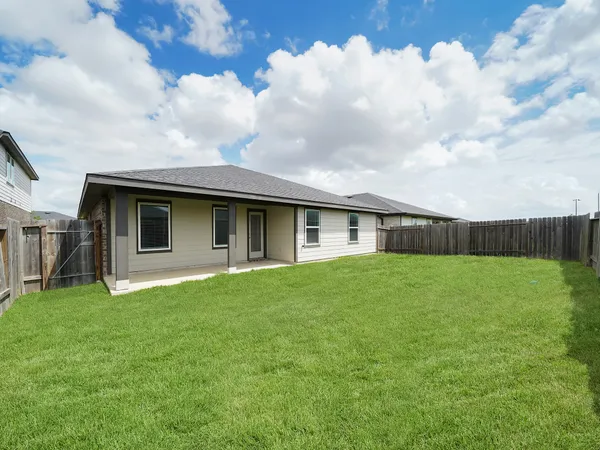 a backyard of a house with lots of green space