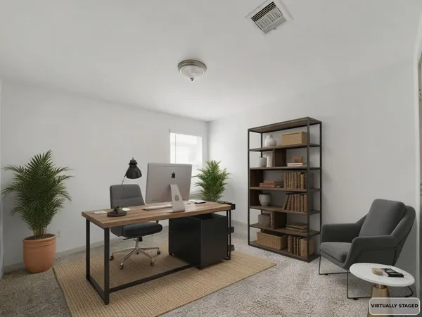 a view of a workspace with furniture