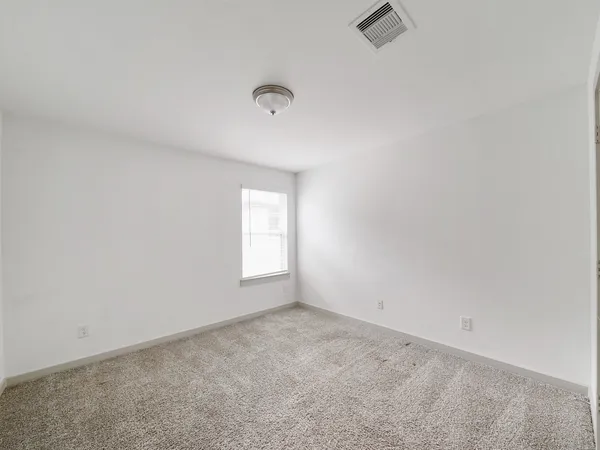 a kitchen with stainless steel appliances a white stove top oven and white cabinets