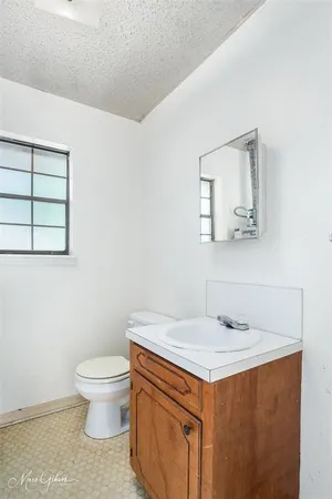 a bathroom with a sink and a toilet