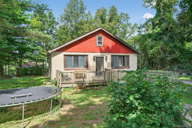 a house with trees in the background