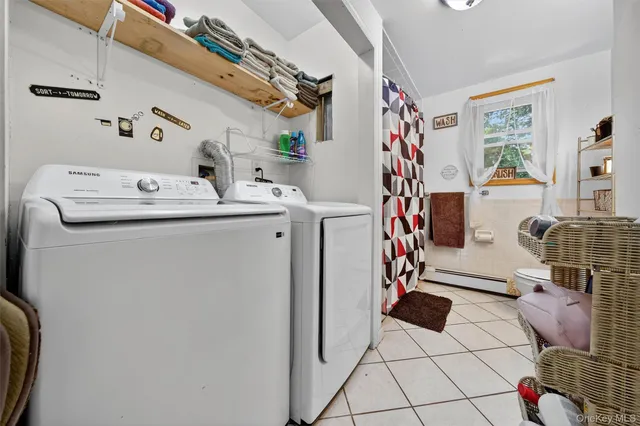 a utility room with dryer and washer