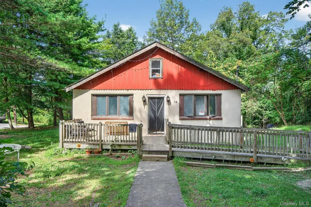 a front view of a house with a garden and pathway
