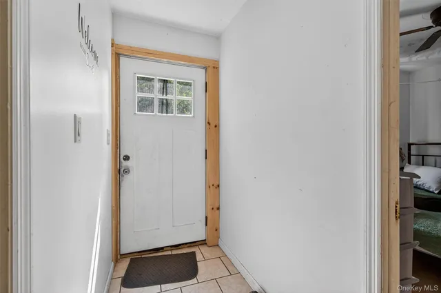 a view of front door with wooden floor