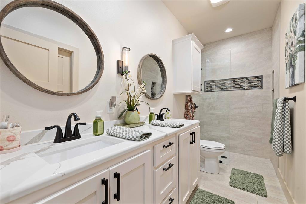 1010 Fm 583 Street West Rising Star, TX 76471 - Photo 29 of 40 a bathroom with a sink a toilet and a mirror
